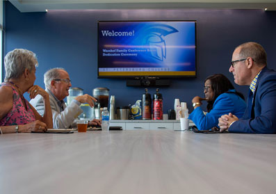 a group from SPC and guests meeting in lobby