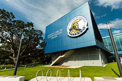 The SPC Saint Petersburg/Gibbs Campus Joseph H. Lang Student Success Center building, beneath a blue sky.