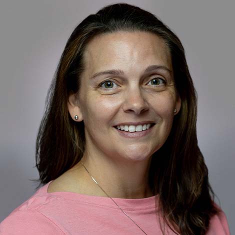 A portrait of Heather Chastain wearing a pink blouse.