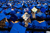 SPC graduates showing off their decorated caps