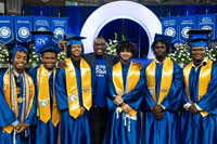 SPC graduates gathered wearing regalia