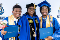 President Williams congratulating two SPC graduates