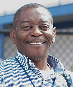 portrait of Dennis Rayford smiling